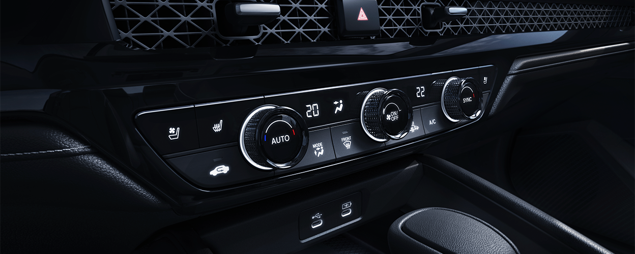 3/4 closeup view of the climate controls in the centre console.