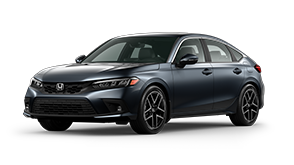 ¾ driver side front facing view of 2022 Civic Hatchback Sport Touring model in Meteoroid Grey Metallic colour