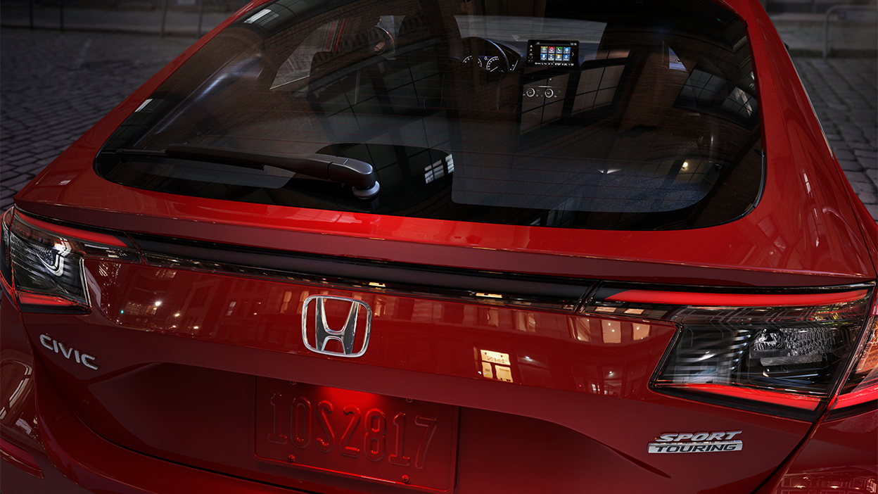 Closeup of hatch door on a red Hatchback.