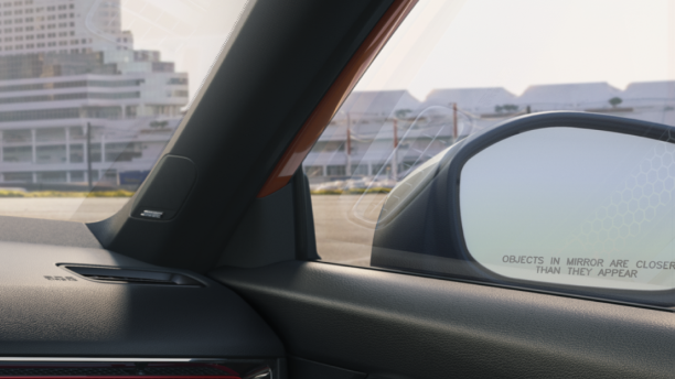 Closeup of passenger-side door mirror, seen from inside Civic Si.