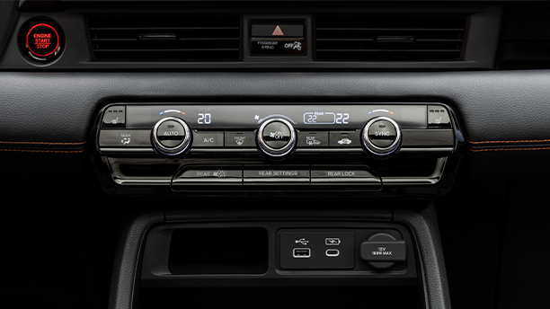Closeup of climate controls on centre console. 
