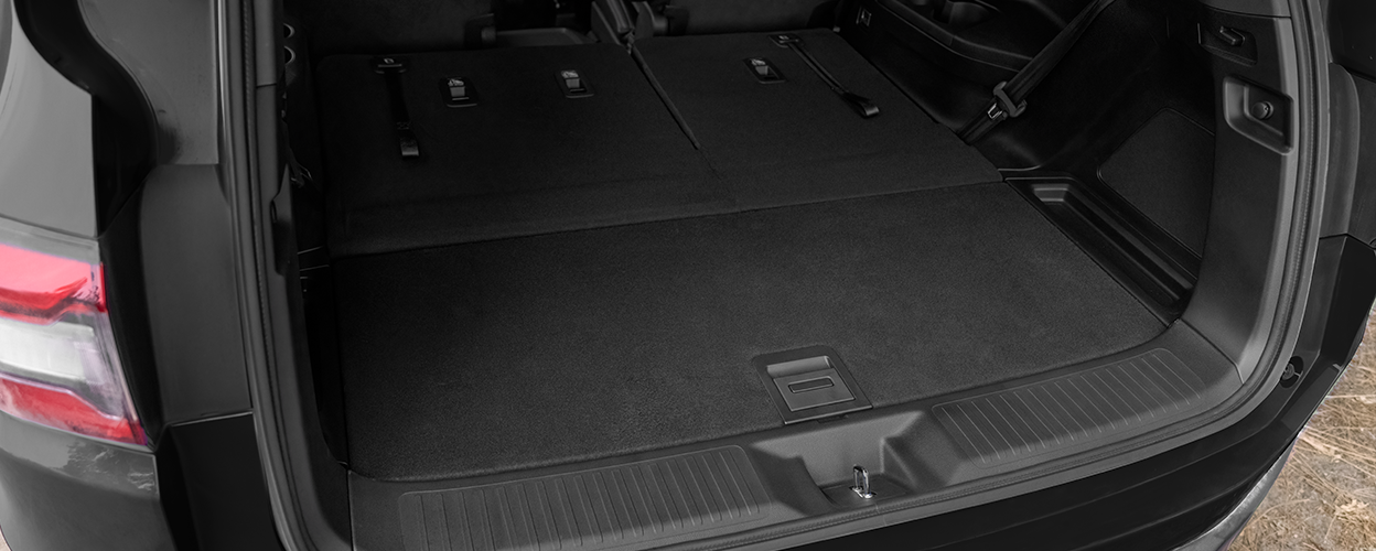 3/4 downward view of the open tailgate, showcasing the spacious trunk. 