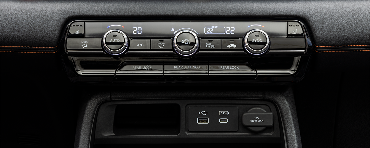 Closeup of climate controls on centre console.